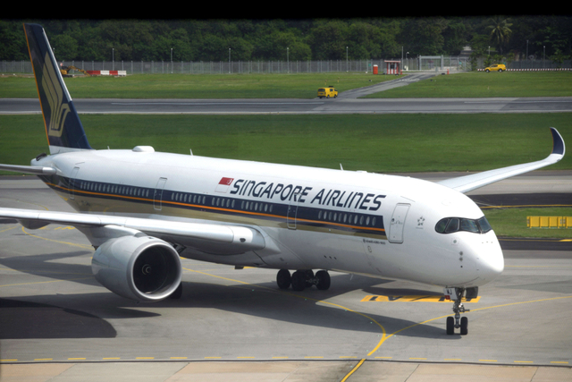 Ilustrasi Singapore Airlines. Foto: Roslan Rahman/AFP