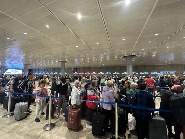 People wait in the departing section at Ben Gurion airport after many flights from abroad are canceled due to the attacks launched by Hamas in Tel Aviv, Israel, on October 8, 2023. Turgut Alp Boyraz/Anadolu Agency via Getty Images
